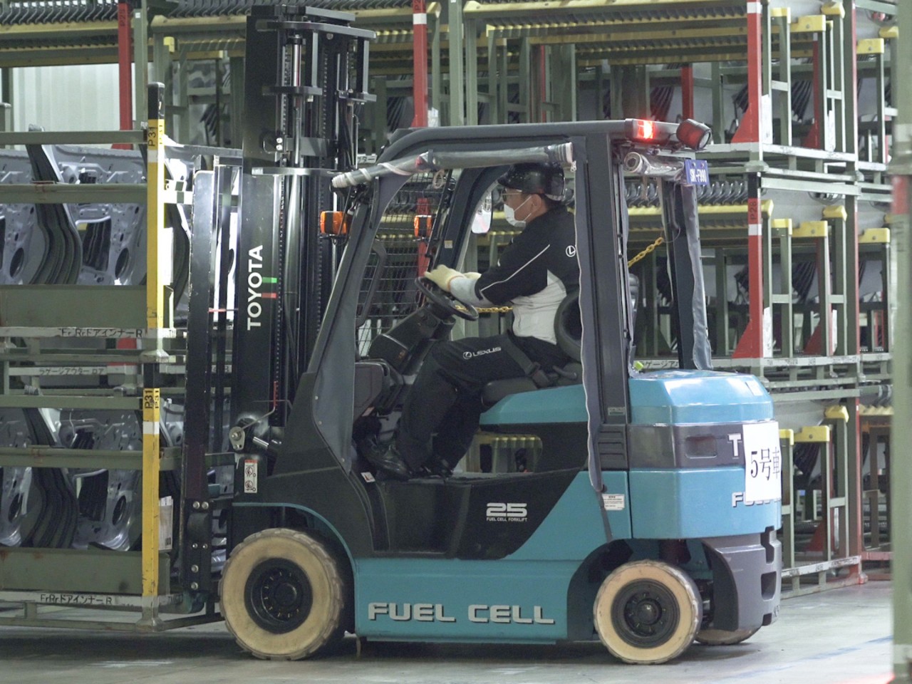 A forklift driver within the Miyata, Japan Lexus plant