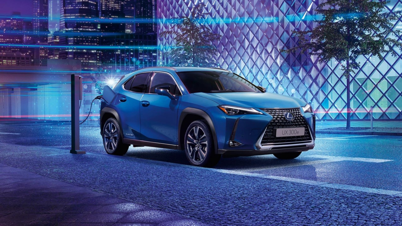 Lexus UX 300e plugged into a public charging tower